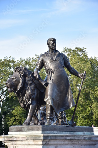 Progress, one of four bronze statues around the memorial the Victoria Memorial is a monument to Queen Victoria, located at the end of The Mall in London.