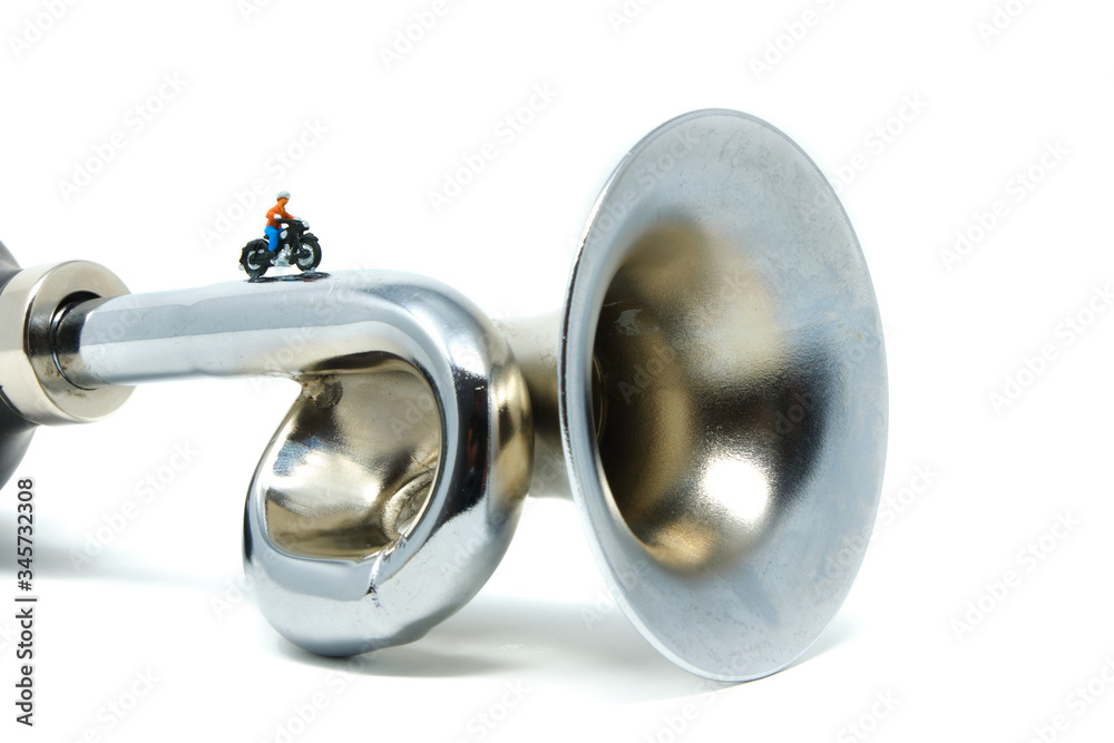 A motorcyclist rides along a metal horn - Tiny People Travelling A motorcyclist rides along a metal horn - Tiny People Travelling