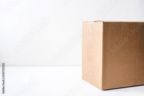 Cardboard box on white background. Copy space for text.