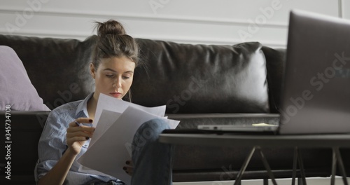 Young woman using digital tablet computer in home photo