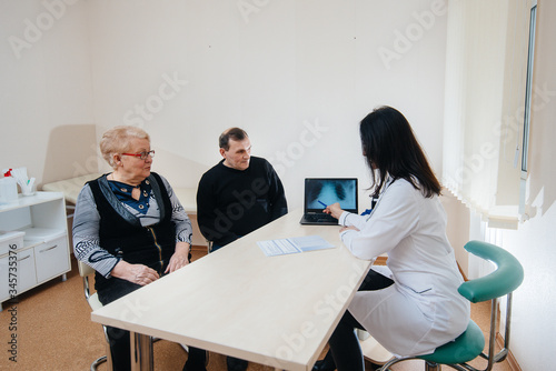 A couple of elderly people at a personal doctor's appointment at a medical center. Medicine and healthcare