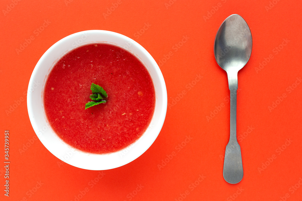Fresh watermelon mint juice on red background from above Fresh watermelon mint juice on red background from above