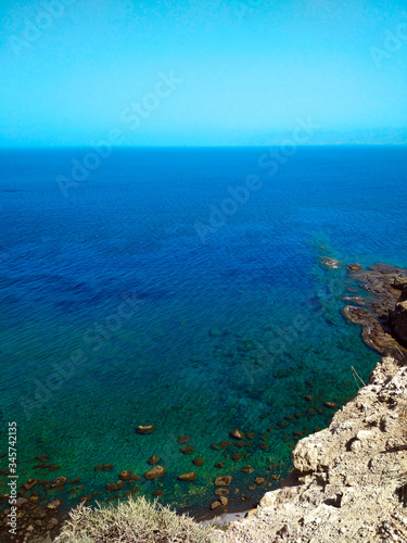 Blue-turquoise sea from the height of the mountain. Beautiful summer landscape.
