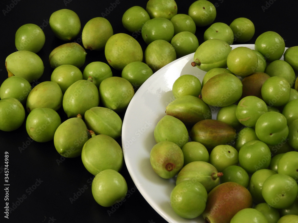 close-up shooting raw nectarine and sour plum,first sour fruits in spring, close-up shooting raw nectarine and sour plum,first sour fruits in spring,
