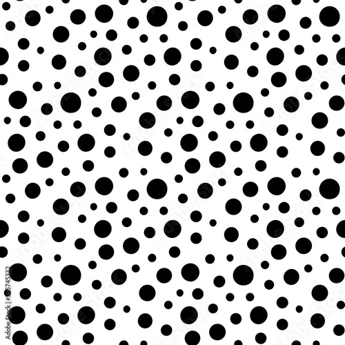 Different black dots isolated on white background. Seamless pattern. Hand drawn vector graphic illustration. Texture.