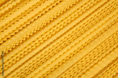 dry mafaldine pasta on a cane tablecloth