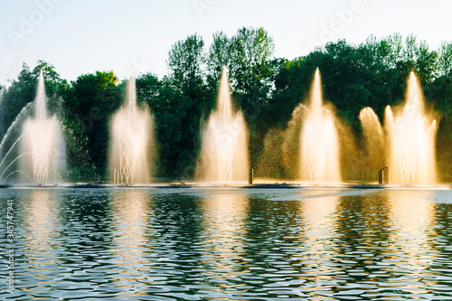 Vinnitsa  Ukraine. Fountains show with music and color. Fountains splashing on the river. Dancing fountains on a beautiful summer evening