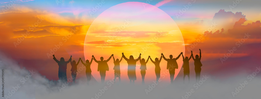Business people holding and raised arms together on teamwork with sunrise background.
 - obrazy, fototapety, plakaty 