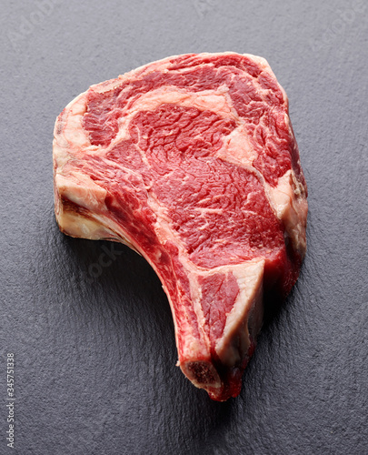 Raw beef steak on dark background