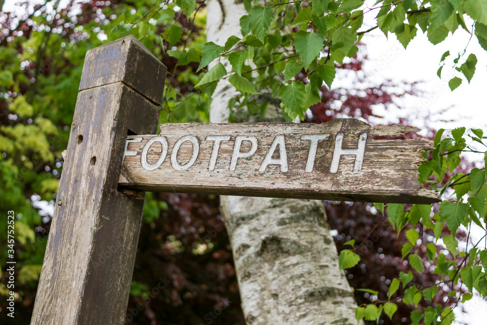 Wooden sign for a footpath