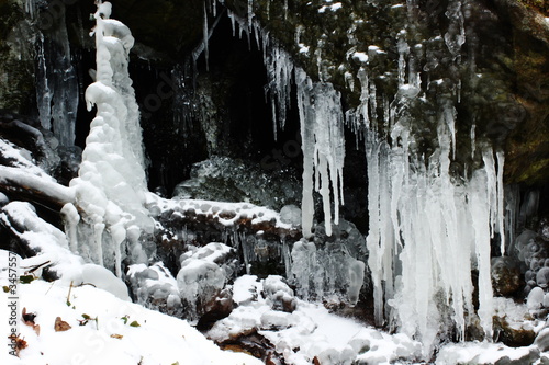 icicles on rocks in forest