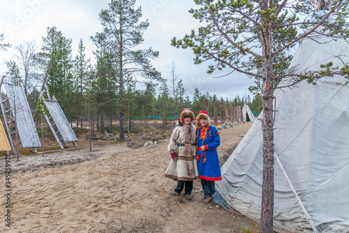 two female saami, sami in national dress, saami village on the Kola Peninsula, Russia.