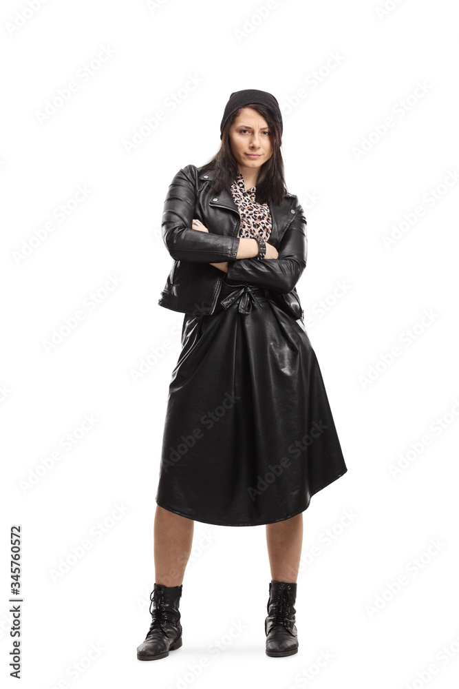 Young woman in black leather jacket and skirt posing with crossed arms Young woman in black leather jacket and skirt posing with crossed arms