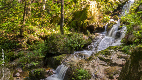 Fototapeta Naklejka Na Ścianę i Meble -  Photography of a long exposure waterfall in the forest