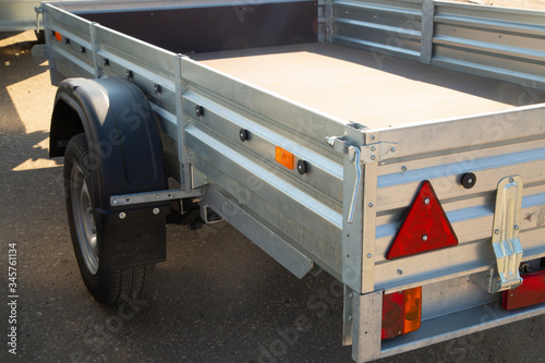 Car open trailer.A store that sells car trailers. Repair and maintenance of trailers for passenger cars.