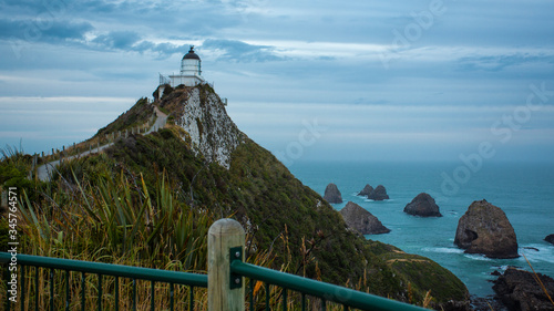  Light house sitting on Nugget point in the Catlins, New Zealand. photo