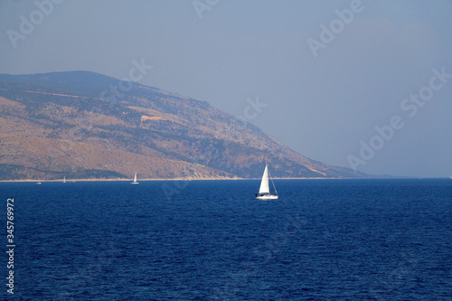Sailing boat on the sea in southern Dalmatia region in Croatia. Beautiful landscape and bright summer day.