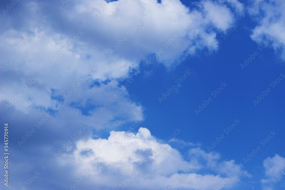 Blurry image of Blue Sky And White Clouds. Horizontal Shot Of A Beautiful Sky Background. Heaven, Nature, Landscapes Concept. Blurry image of Blue Sky And White Clouds. Horizontal Shot Of A Beautiful Sky Background. Heaven, Nature, Landscapes Concept.