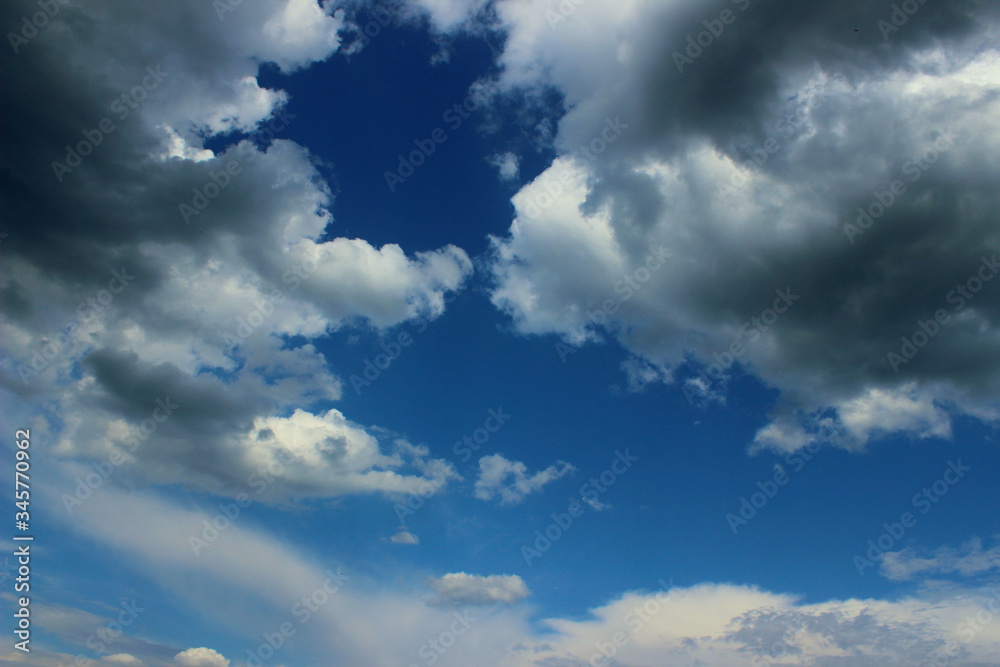Blurry image of Blue Sky And White Clouds. Horizontal Shot Of A Beautiful Sky Background. Heaven, Nature, Landscapes Concept. Blurry image of Blue Sky And White Clouds. Horizontal Shot Of A Beautiful Sky Background. Heaven, Nature, Landscapes Concept.