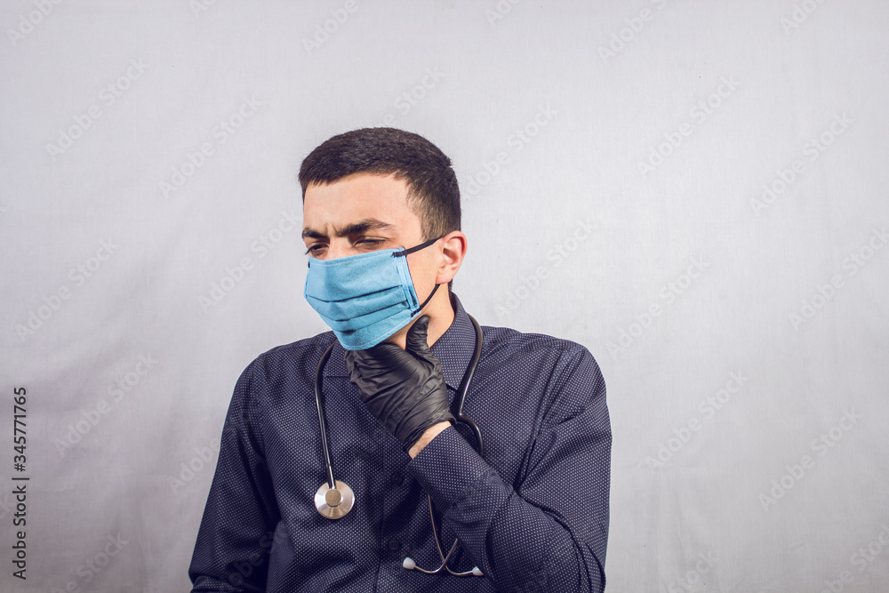 masked doctor touches throat masked doctor touches throat