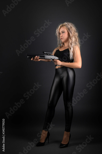 beautiful sexy girl holding gun 