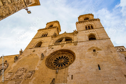 Low-angle high section view of the Altamura Cathedral or Cathedral of Santa Maria Assunta facade in Altamura, Apulia, Italy