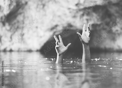 hands in water  drowning concept