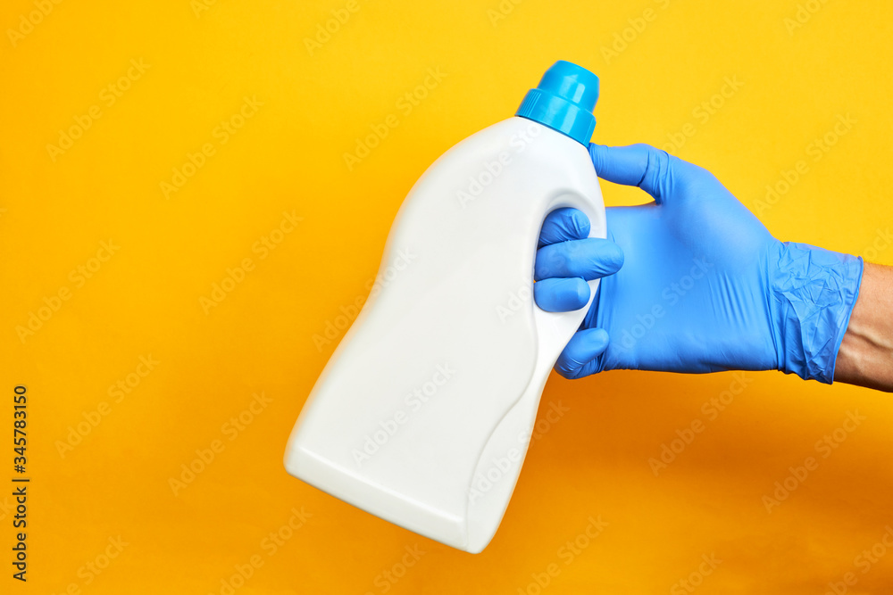chemical cleaning service concept. product for wash up. copy space. bright orange background. chemical cleaning service concept. product for wash up. copy space. bright orange background.