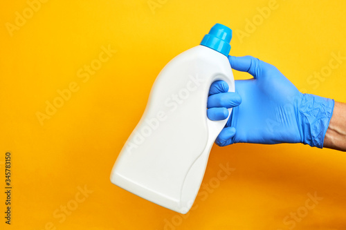 chemical cleaning service concept. product for wash up. copy space. bright orange background.