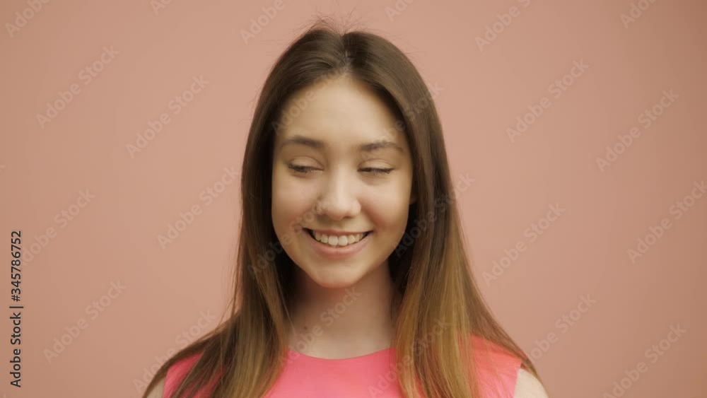 Portrait of young beautiful cute cheerful girl smiling looking at camera Portrait of young beautiful cute cheerful girl smiling looking at camera