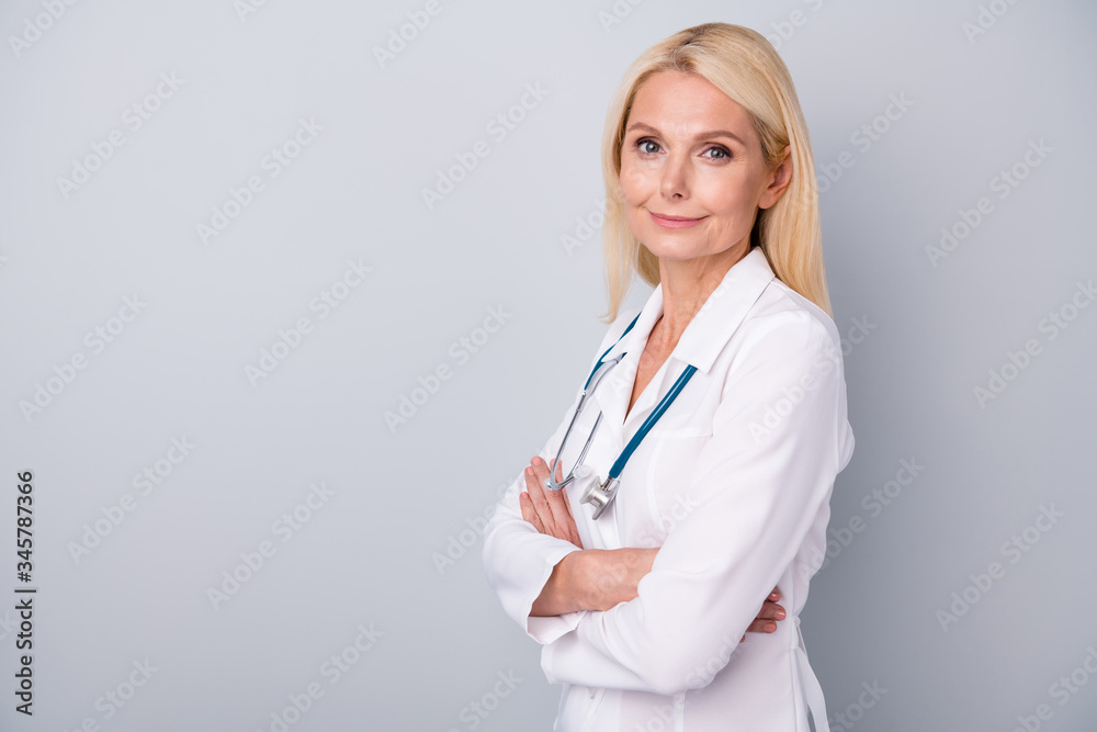 Turned photo of qualified confident old woman doc cross hands stand copyspace ready coronavirus protection prevention pneumonia spreading wear white coat isolated over gray color background Turned photo of qualified confident old woman doc cross hands stand copyspace ready coronavirus protection prevention pneumonia spreading wear white coat isolated over gray color background
