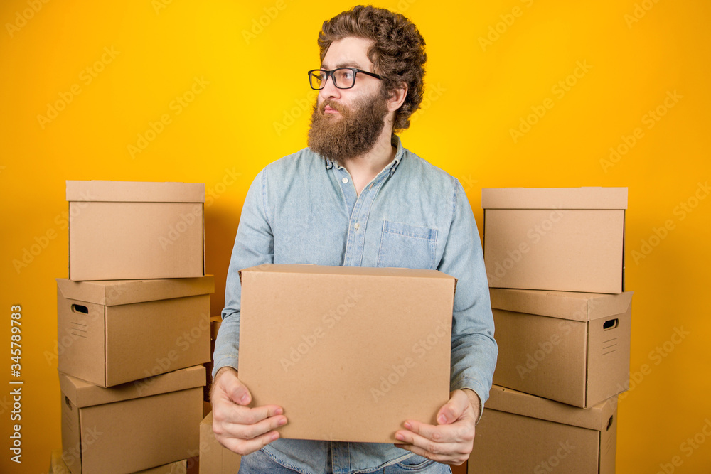 Delivery of goods by courier holding a box with a parcel Delivery of goods by courier holding a box with a parcel