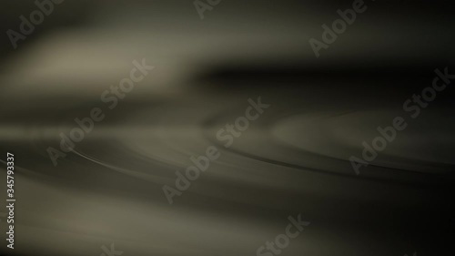 Macro of spinning vinyl record on turntable