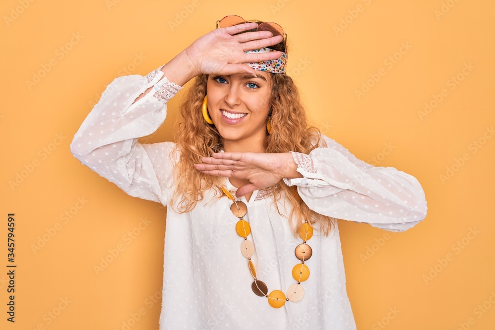 Young beautiful blonde hippie woman with blue eyes wearing sunglasses and accessories Smiling cheerful playing peek a boo with hands showing face. Surprised and exited