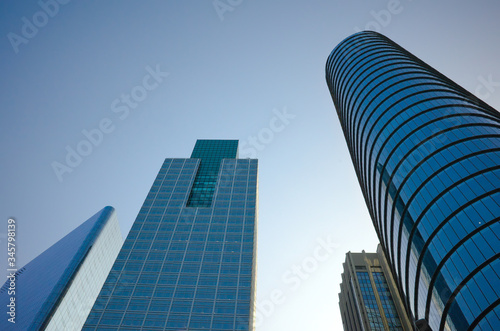 Low angle view of glass and steel building facade of modern office buildings. High rise skyscrapers in Buenos Aires  Argentina.