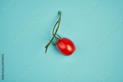 cherry tomatoes on a green background