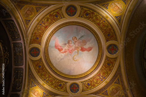 Cordoba  Argentina - January  2020  Interior of Cathedral of Cordoba church   Iglesia de Nuestra Senora de la Asuncion  . Painted ceiling fresco view of two angles in the sky.