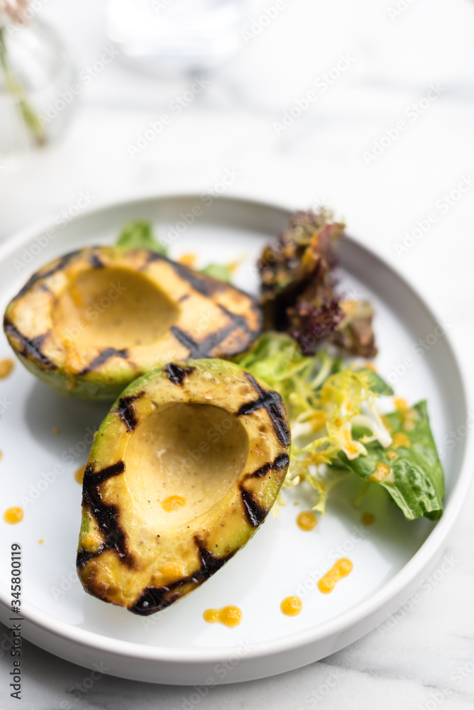 Grilled Avocado with Lettuce and Spicy Sauce