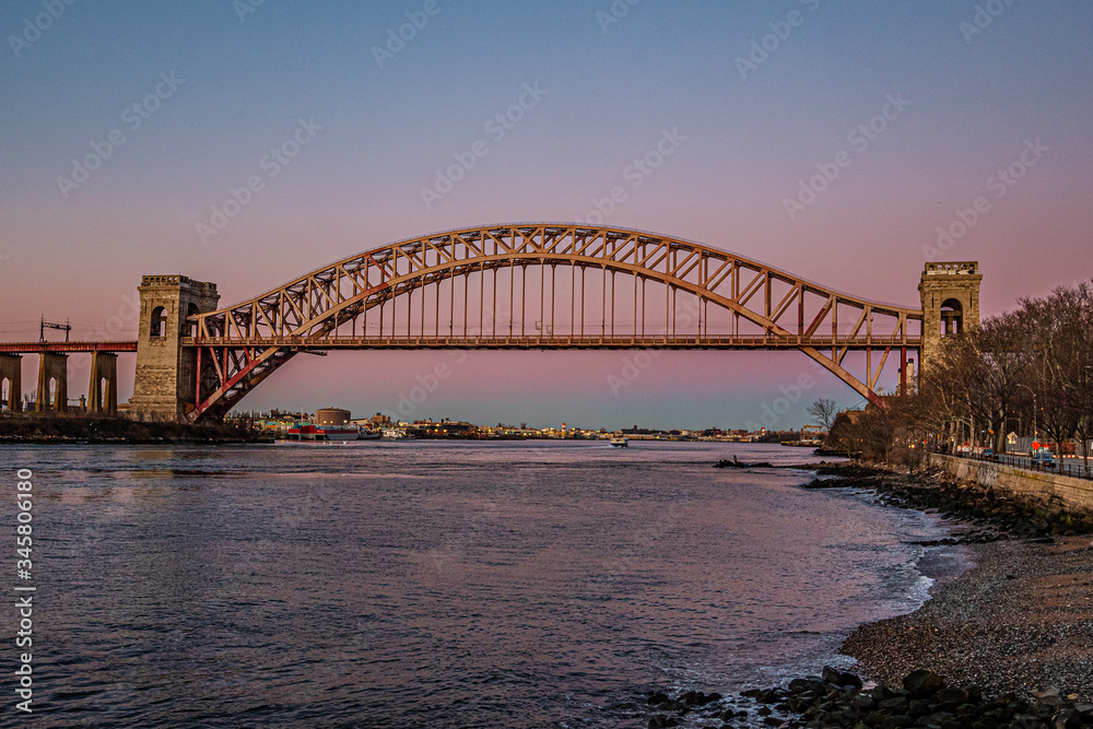 hell gate bridge at sunset