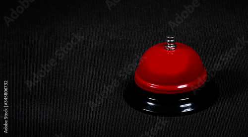 Red button on a black background. Сoncept