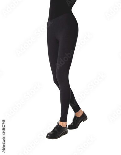 Woman wear black blank leggings mockup, isolated, clipping path. Women in clear leggins template. Cloth pants design presentation. Sport pantaloons stretch tights model wearing. Slim legs in apparel.