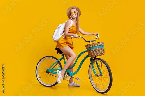 Summer Mode. Portrait Of Stylish Girl Riding Vintage Bicycle And Smiling © Prostock-studio