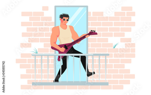Guy plays the guitar on balcony 