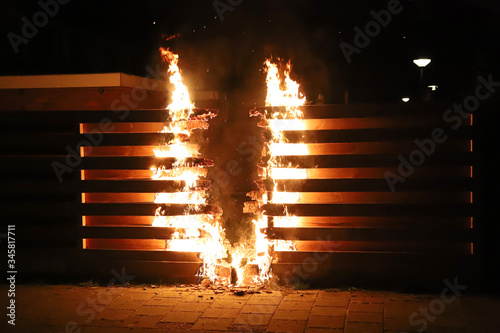 Burning fence in the dark