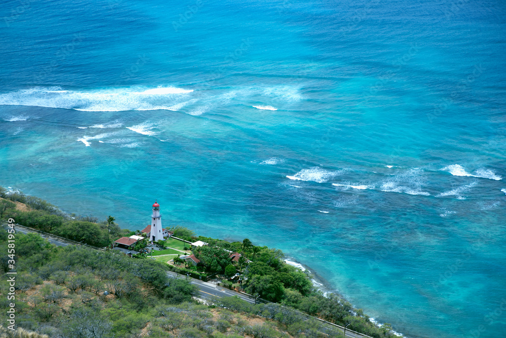 
Looking down on the Diamond Head lighthouse and Pacific Ocean in Honolulu, Hawaii. 
