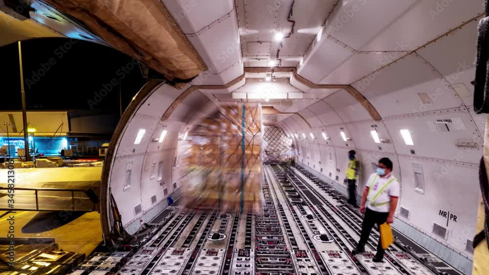 Loading air cargo freighter inside aircraft cargo hold loop Stock Video ...