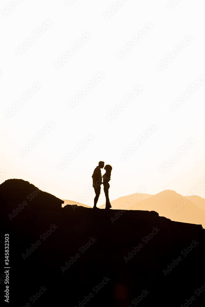 Couple in love hugging in the sunset. Wedding in Majorca by the sea. Couple in love hugging in the sunset. Wedding in Majorca by the sea.