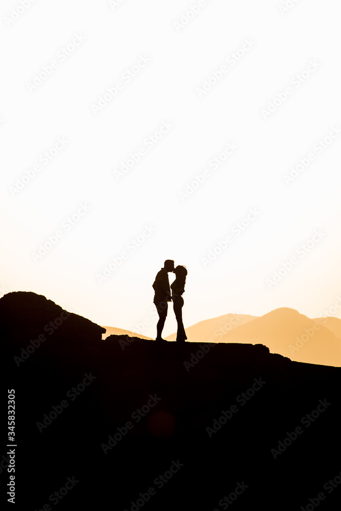 Couple in love hugging in the sunset. Wedding in Majorca by the sea.