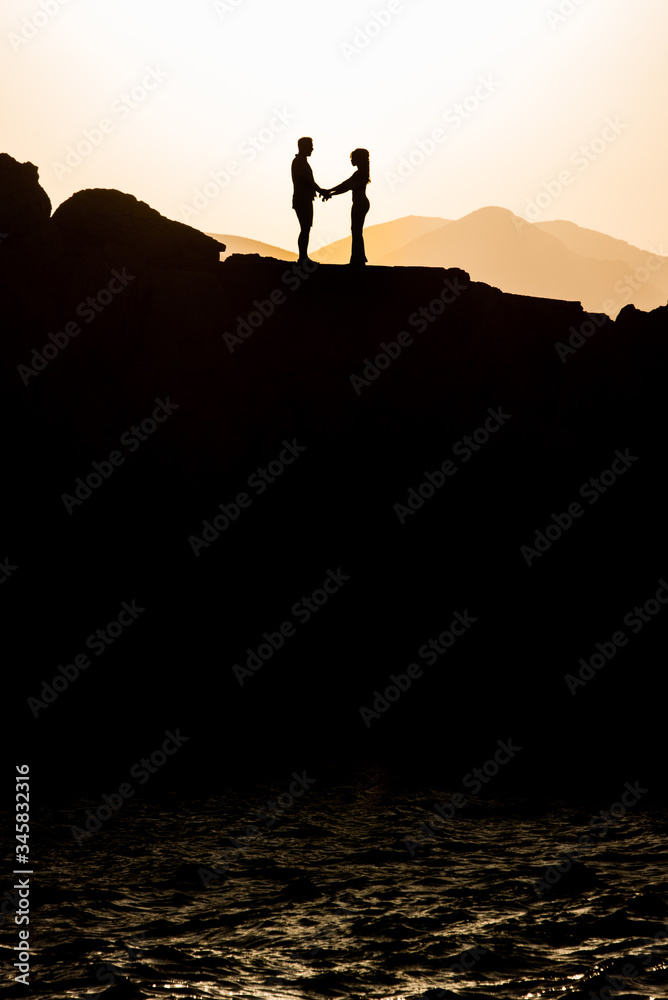 Couple in love hugging in the sunset. Wedding in Majorca by the sea.