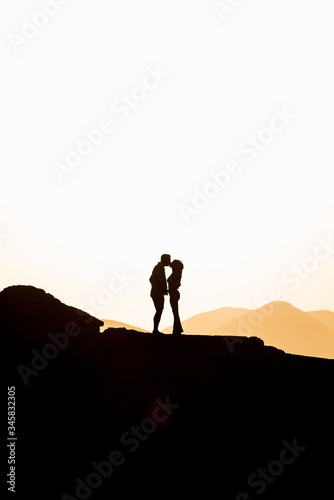 Couple in love hugging in the sunset. Wedding in Majorca by the sea.